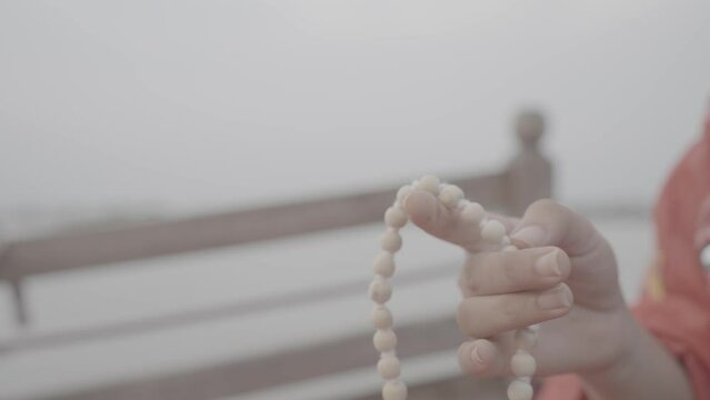 In the gentle rhythm of breath and the touch of Mala beads, an Indian meditation unfolds, weaving a sacred tapestry of inner peace and spiritual connection.4k footage 