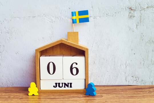 Wooden calendar with the date 06 June . National Day of Sweden 