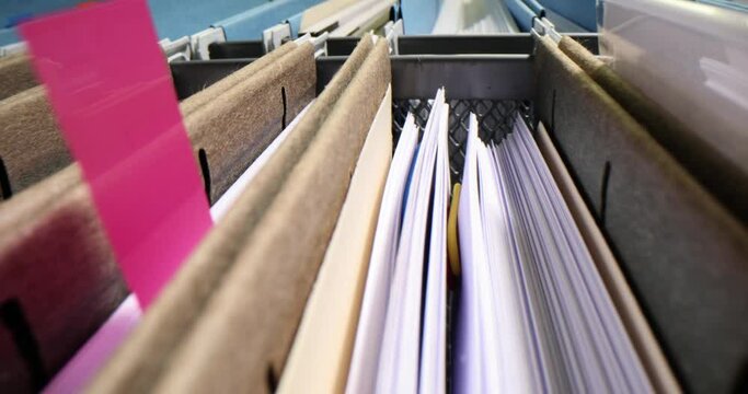 Folders with documents in storage box in archive closeup 4k movie slow motion