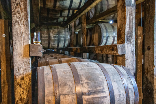 Whiskey glass in a rickhouse