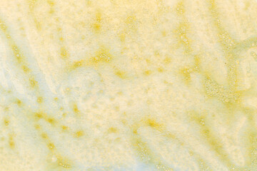 Yellow abstract background, art collage. Blots and stains of paint on white paper