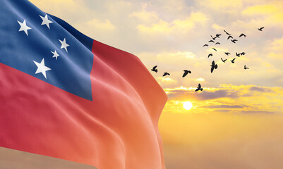Waving flag of Samoa against the background of a sunset or sunrise. Samoa flag for Independence...