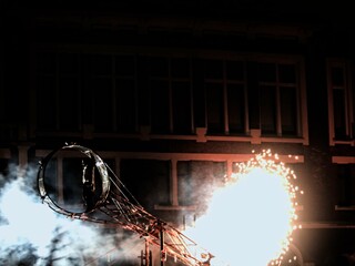 Lens, France - 03 December 2023 - Saint Barbara's Day Fireworks Festival - Festival of miners, firemen and pyrotechnicians. Organised in an old mining building - Pyroue infernale show with fireworks