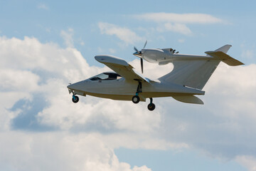 Fototapeta na wymiar Small aircraft soaring through clear blue skies.
