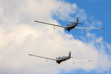 Fototapeta na wymiar Small aircraft soaring through clear blue skies.