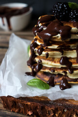 Pancakes with berries. on a wooden background. dessert. breakfast.