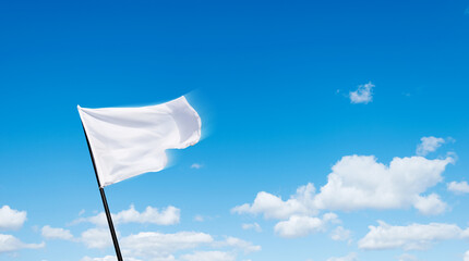 White flag flying against blue sky background