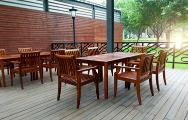 Fototapeta na wymiar Outdoor cafe with wooden furniture