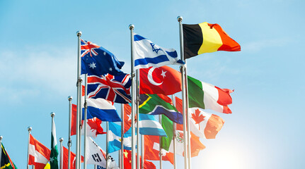 Set of flags fluttering in the wind against blue sky background - obrazy, fototapety, plakaty