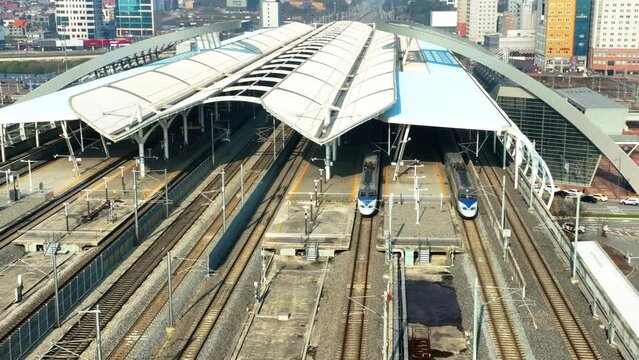 a high-speed train departing from a station,  KTX train in Korea, Osong station