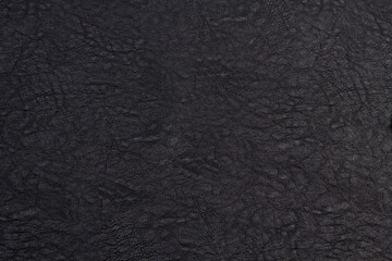 Fototapeta premium Black leather texture. Black skin background close-up in your project.