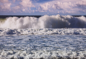 Seascape in the early morning, sunrise over the stormy sea. Nature landscape