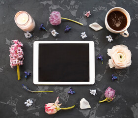 Festive invitation card with beautiful flowers and cup of coffee on the dark background
