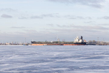 Crude Oil Tanker is loading in port of Saint-Petersburg in winter