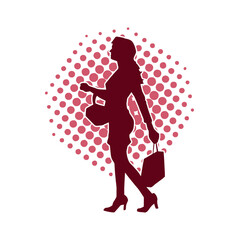 Silhouette of a slim young woman carrying shopping bags.