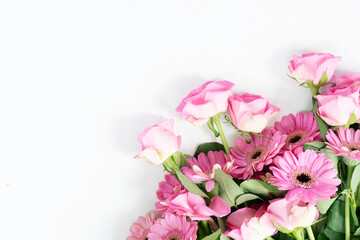 Happy womens day 8th of march background, bouquet of roses and herberas over plain green background