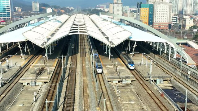 a high-speed train departing from a station,  KTX train in Korea, Osong station