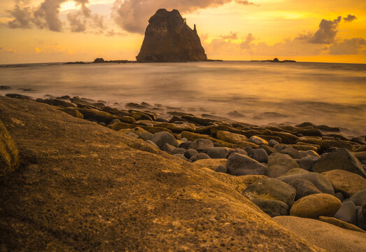 Sunset at the rocky beach in Papuma, Jember, East Java, Indonesia