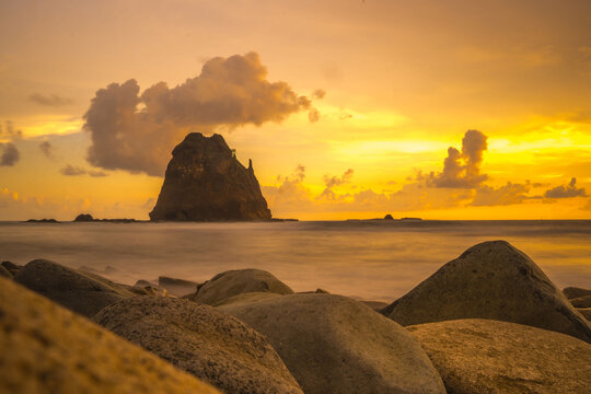 Sunset at the rocky beach in Papuma, Jember, East Java, Indonesia