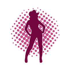 Silhouette of a female model wearing cowboy costume. Silhouette of a cowgirl model in pose.