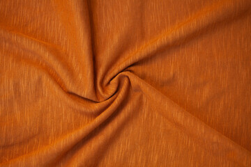 brown light abstract fabric background with soft waves.