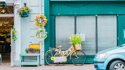 Vintage bicycle with front basket full of flowers