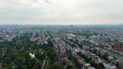 Fototapeta na wymiar Amsterdam, Netherlands. Vondelpark. Museumplein square. Panoramic view of the city in summer in cloudy weather, Aerial View