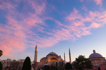 Ayasofya or Hagia Sophia with pink clouds at sunrise. Travel to Istanbul