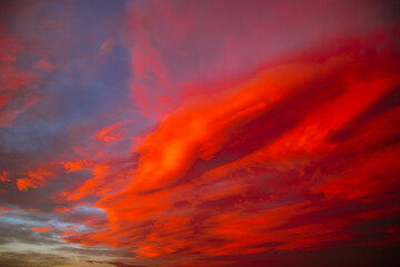 Red or orange clouds at sunset. Cloudscape background photo