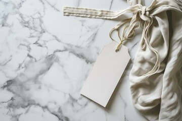 a white tag tied to a cloth on a marble surface