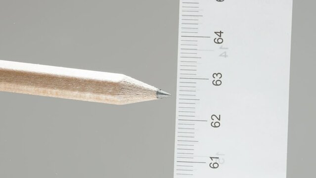 We measure the distance opposite to the pencil with a ruler, the concept of building a house.