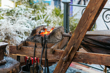 blacksmith working in the fireplace