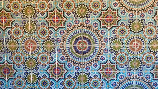 Colorful zellige tiles of a mosque in Morocco. Mosaic pattern, traditional Islamic geometric design. Moroccan craft, handmade. 4k footage.
