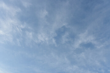 Blue sky and tiny white clouds for background.