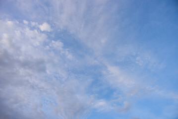 Blue sky and tiny white clouds for background.