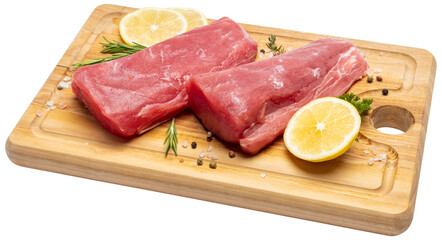 Fresh tuna Fish steak on a wooden cutting serving board isolated