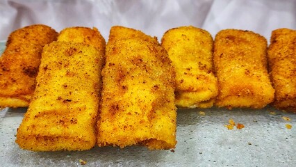 a tray of fried fish sticks on a table