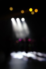 Defocused entertainment concert lighting on stage, blurred disco party and Concert Live.