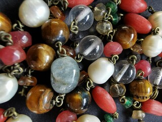 Beads with precious stones close-up.