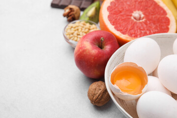 Natural sources of serotonin. Many different products on light table, closeup. Space for text
