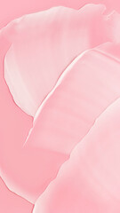 Textura de una crema de cosmética, sobre un fondo rosa. 