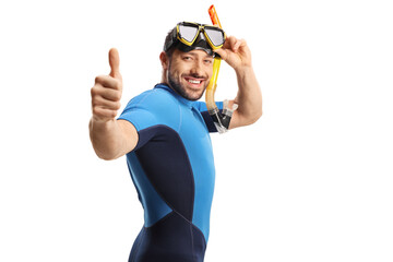 Man wearing a diving suit and mask and gesturing thumbs up