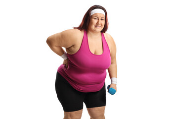 Woman in sportswear with a painful back holding a dumbbell