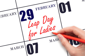 February 29. Hand writing text Leap Day for Ladies on calendar date. Save the date.