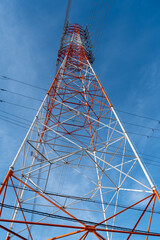 High voltage tower on sky background
