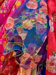 Close-up of multi-colored scarves , dupatta stola chunri , stola showing fabric and patterns used by ladies in clothing