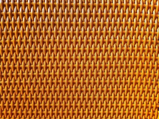 Texture and color due to sunlight on woven imitation rattan for chairs