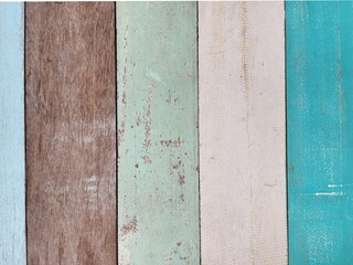 Wooden planks covered with faded oil paint blue, white, green, turquoise, some sheets are not...