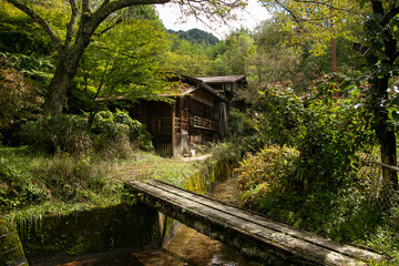 Fototapeta na wymiar Traditional japanese houses on the Nakasendo trail between Tsumago and Magome in Kiso Valley, Japan.