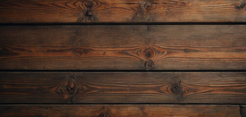 This image shows a close-up view of a wooden surface, characterized by horizontal planks with visible grains and textures. The wood has a dark brown color, and the lines between the planks are clearly